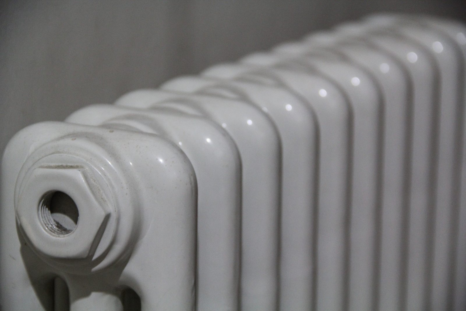 A closeup shot of white radiator on a blurred background