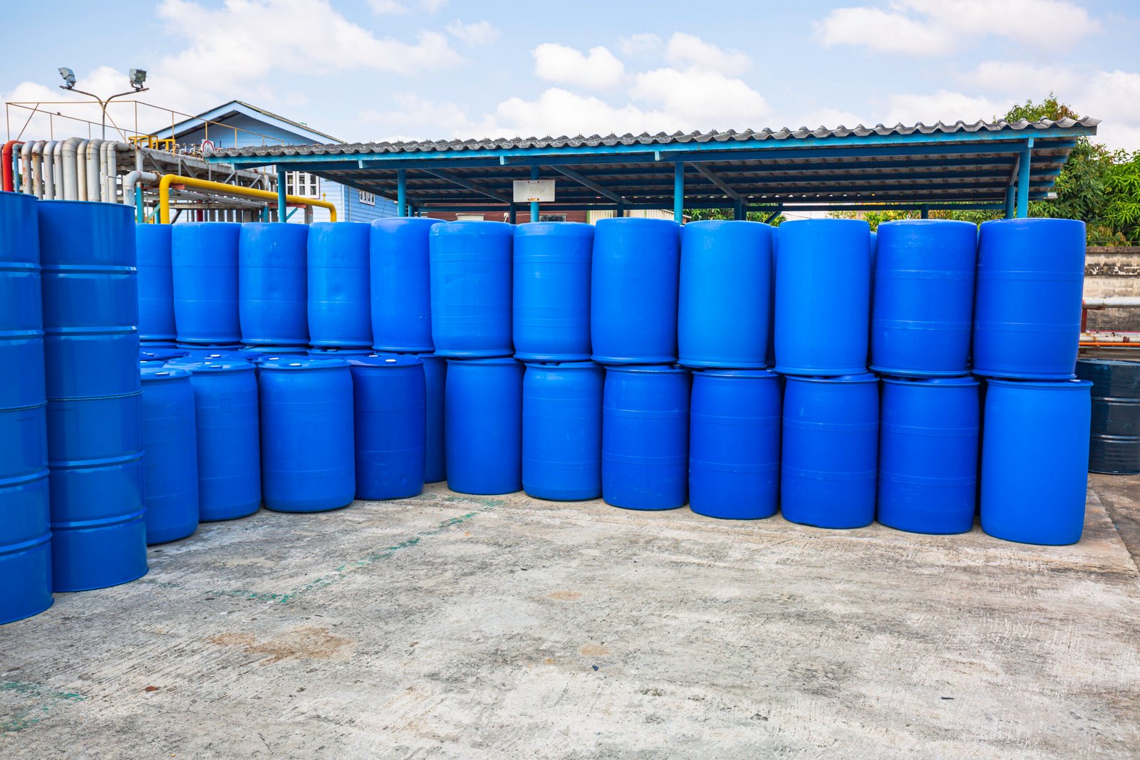 Oil barrels blue or chemical drums horizontal stacked up